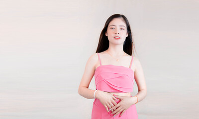 Beautiful woman bust up image isolated with pink dress