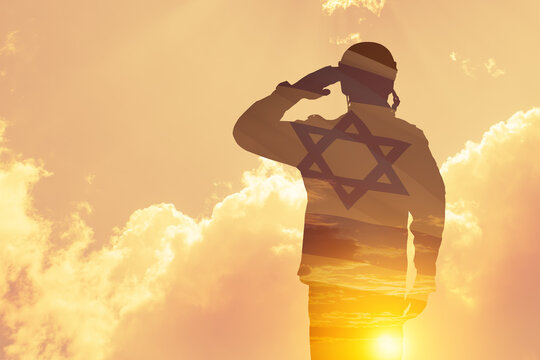 Double exposure of Silhouette of a solider and the sunset or the sunrise against Israel flag. Concept - armed forces of Israel.