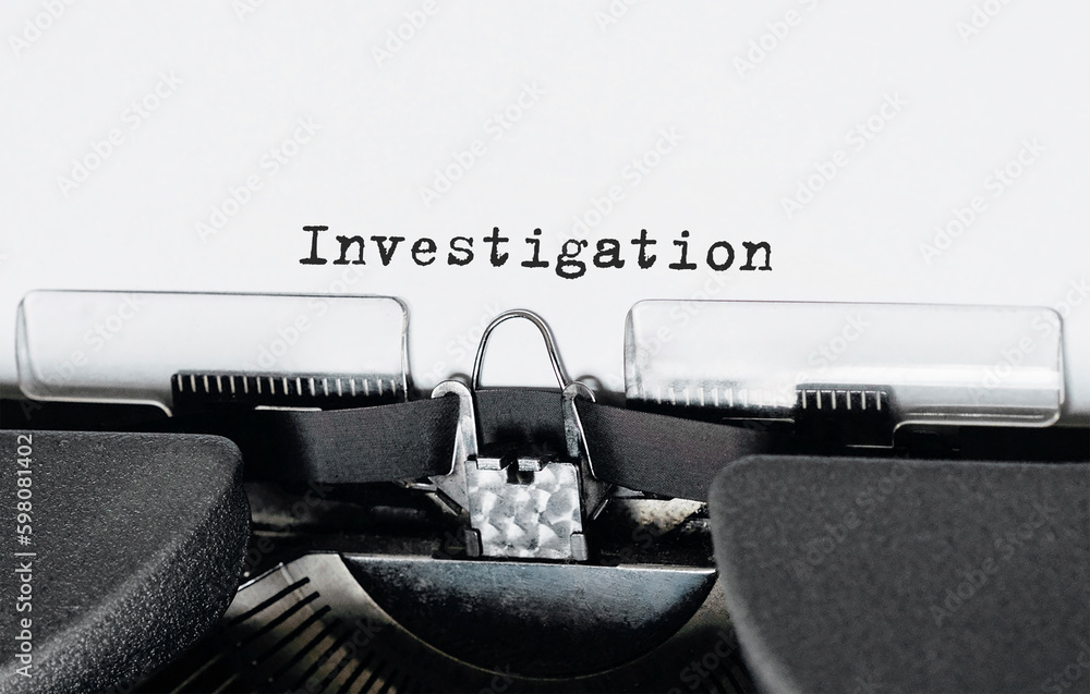 Poster text investigation typed on retro typewriter