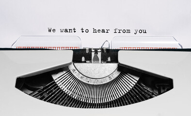 Text We want to hear from you typed on retro typewriter