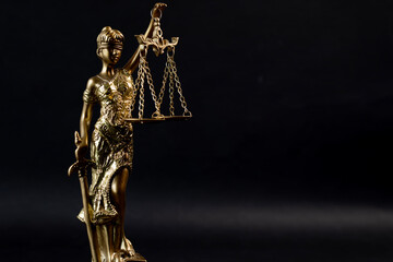 Justice lady statue with books