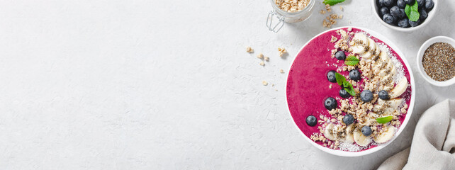 Blueberry Smoothie Bowl with Granola, Banana, and Chia Seeds, Healthy Food, Vegan or Vegetarian Diet Food Concept