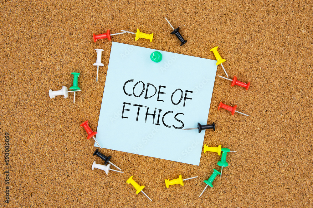 Fototapete code of ethics text on light blue post-it paper pinned on bulletin cork board surrounding by multi c