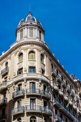 Fototapeta na wymiar Barcelona iconic architecture is a timeless reminder of its history, with beautiful blue buildings stretching to the sky. A perfect travel destination for all