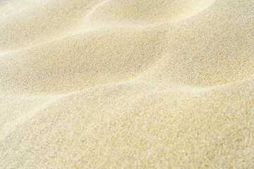 White wavy sand background. Macro shot with blur. Copy space.