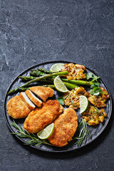 fried chicken breasts with asparagus and potatoes