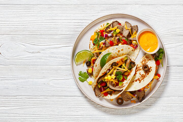 Beef Steak Tacos with veggies, avocado, corn