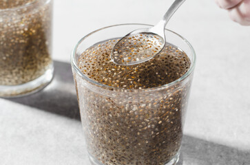 Water with Chia Seeds, Healthy Drink on Bright Background