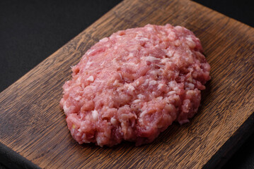 Raw minced beef, pork or chicken meat with salt, spices and herbs