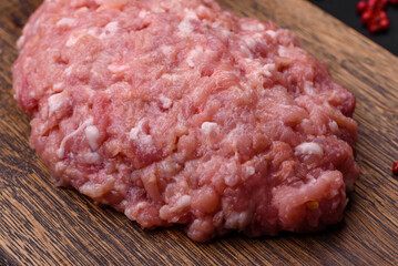 Raw minced beef, pork or chicken meat with salt, spices and herbs