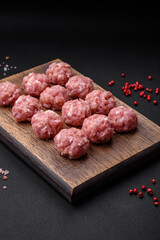 Raw meatballs of minced meat beef, pork or chicken with salt, spices and herbs
