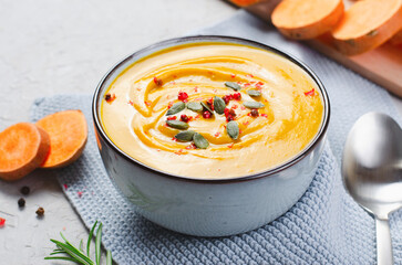 Sweet Potato Soup, Fresh Homemade Pumpkin, Sweet Potato, Carrot Soup in a Bowl on Bright Background