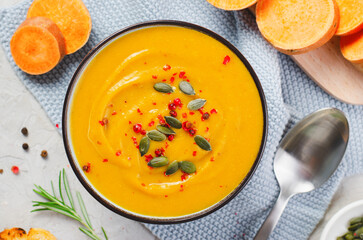 Sweet Potato Soup, Fresh Homemade Pumpkin, Sweet Potato, Carrot Soup in a Bowl on Bright Background