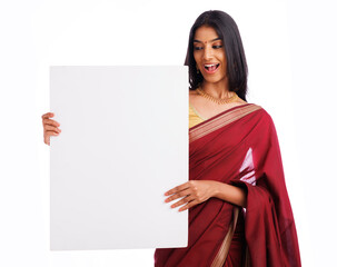 Exited pretty Indian young woman in saree holding sign board isolated on white.
