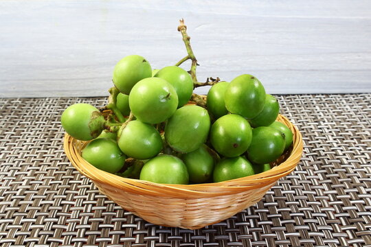 popular indian gujarati food curry subji and pickle fruit known in india and africa as gunda,manjack,snotty gobbles,glue berry,indian cheery,lasura or geduri