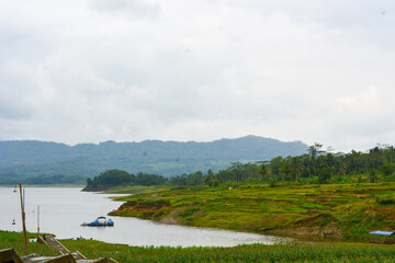 Overhead view of fishing gear, wooden boat, fishing nets, fishing tackle. View by the lake