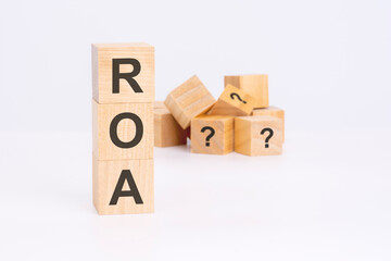 roa - Return On Assets - text on wooden cubes