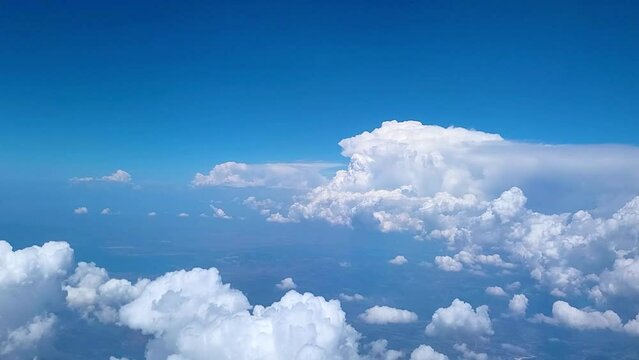View of clouds in sky from plane in daytime