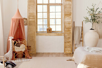 Playroom interior with crib with canopy © aprilante