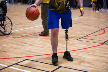 Fototapeta premium Lviv, Ukraine - May 29, 2023: Invictus Games Ukraine 2023 in Lviv. Wheelchair basketball match