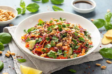 Asian Quinoa salad with fresh vegetables, peanuts and herbs. Healthy food.
