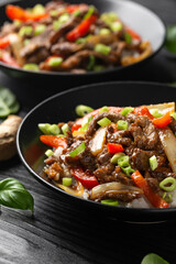 Stir fry Crispy Orange Beef with sweet peppers, onion and rice. Asian food