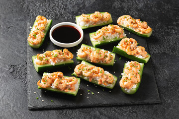 Cucumber Shrimp Sushi Boats with Spicy Mayo, Rice, Chives and sesame seeds