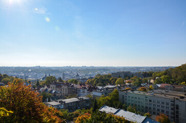 Panoramic view of old historical city center with churches, town hall and houses roofs at sunny autumn day. Lviv, Ukraine