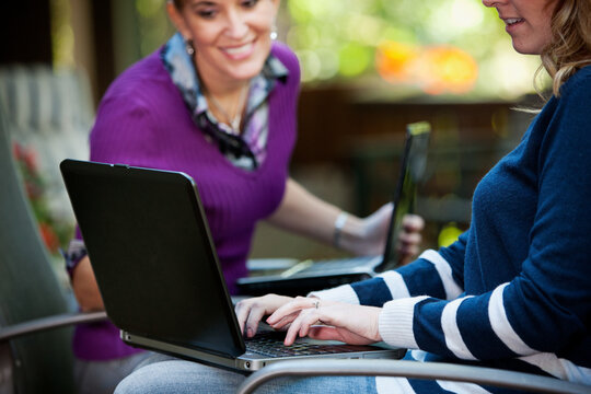 Working: Two Women Working Together On Project