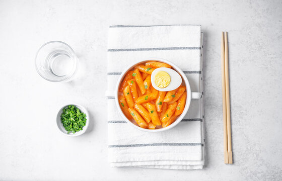Tteokbokki. Traditional korean rice sticks in hot spicy sauce