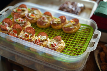 Decorated sandwiches in an artificial crate.