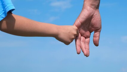 Hold mum hand with love against sky. A view of little child hand hold woman finger in the open air. Generative AI