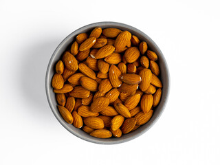 walnut almond in a plate on a white background. view from above