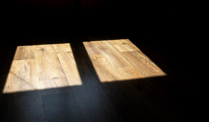 Abstract background of wooden floor with shadows from the window.