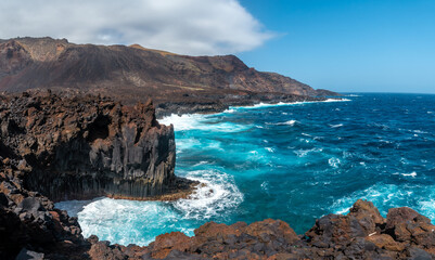 Cliffs with volcanic stones in the village of Tamaduste on the island of El Hierro, Canary Islands, Spain - obrazy, fototapety, plakaty