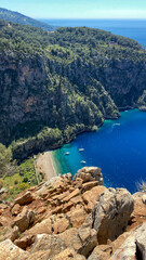 Butterfly Valley (Turkish: Kelebekler Vadisi) is a valley in Fethiye district, Mugla Province, on the Mediterranean coast of Turkey. Oludeniz - Fethiye, Mugla, Turkey.