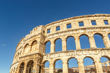 View at the amphitheatre in Pula, Istria, Croatia, in early spring during a sunny day against clear...