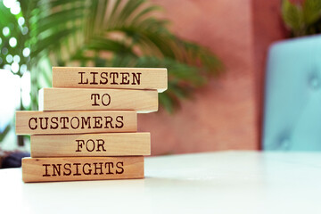 Wooden blocks with words 'Listen to customers for insights'. - obrazy, fototapety, plakaty