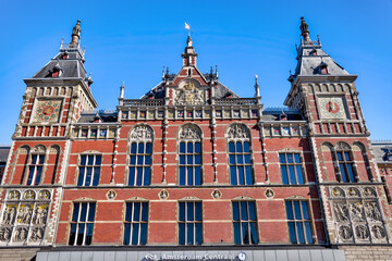 Amsterdam, Netherlands - March 28, 2023: Exterior of the historic Amsterdam Centraal rail terminal

