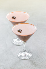Coffee Cream jelly,  Panna Cotta in a martini glass. Light gray background. Close up