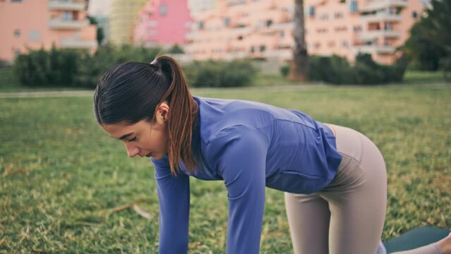 Yogi girl yoga cat pose making at green park. Fitness woman performing asana Generative AI