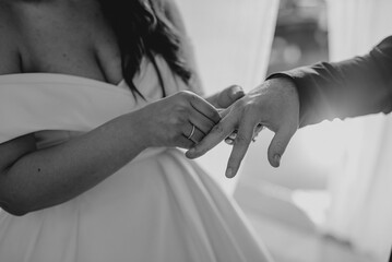 wedding details for bride and maid of honor groom getting married pink and white bathrobes preparations bridesmaids wedding day dress white rings	
