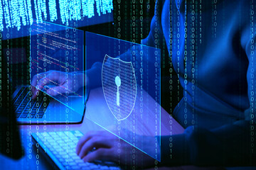 Cyber attack. Hacker working with computers in dark room, closeup. Binary code and virtual screens near him