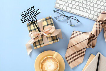 Happy Father's Day composition. Flat lay gift box, glasses, keyboard, coffee cup, necktie on blue background.