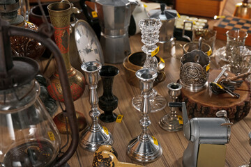 Fototapeta na wymiar Many different items on wooden table. Garage sale