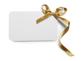 Blank gift card with golden bow isolated on white, top view