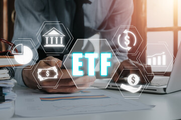 ETF Exchange traded fund stock market trading investment financial concept, Businessman using...