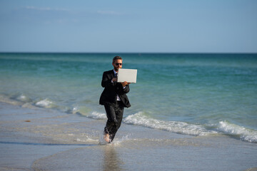 Excited businessman in wet suit run in sea. Funny business man, crazy comic business concept. Remote online working. Crazy summer business. Fun business lifestyle. Funny freelance businessman.