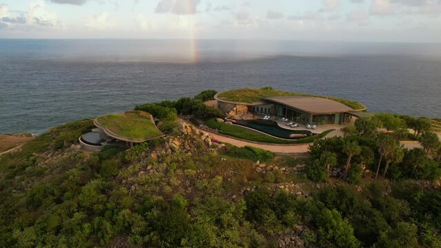 Aerial View, Villa Mansion With Green Roof and Rainbow Above Caribbean Sea. British Virgin Islands, Drone Shot