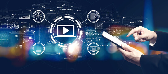 Webinar concept with businessman using a tablet computer